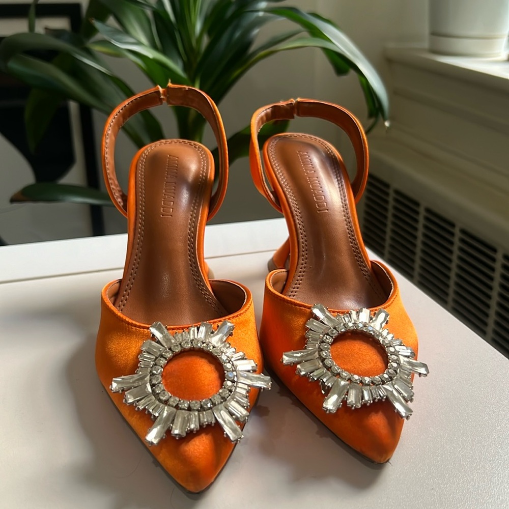 Orange slingback pumps with crystal embellishment